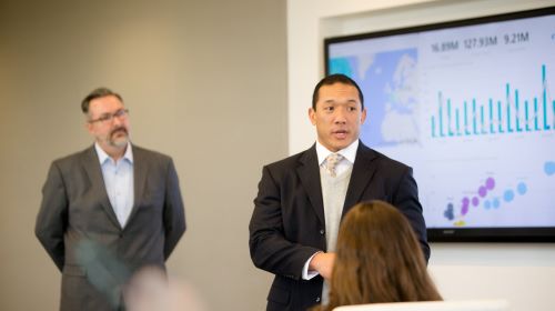 A man giving a presentation at a meeting