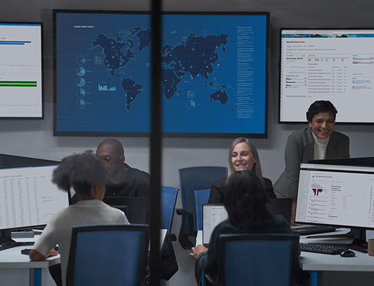 Office with a large screen displaying a map with five employees talking with each other