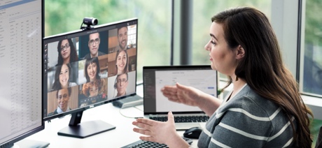 Woman at a desk talking on a video call