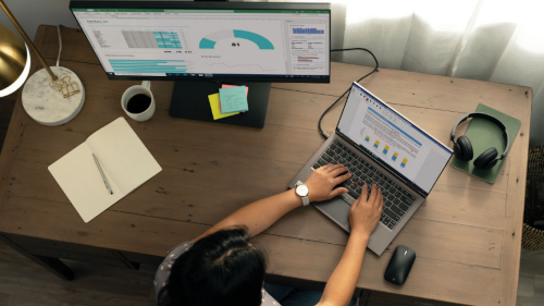 Businesswoman holding a tablet while working from home