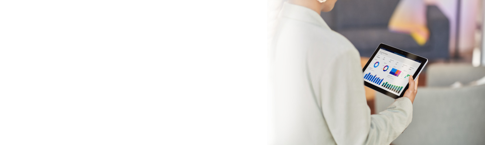 Women holding a tablet open with Dynamics 365