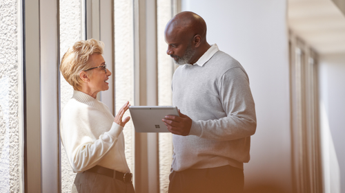 businesspeople in a casual meeting with tablet