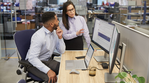 man and woman discussing work