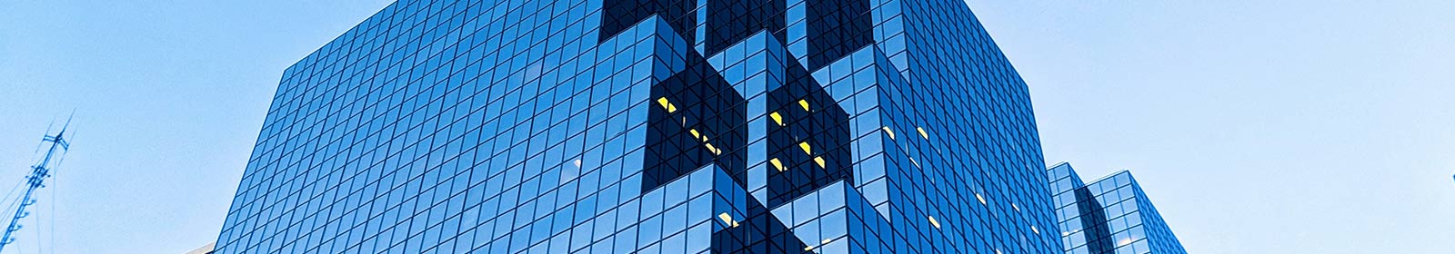 The photo shows a modern glass building