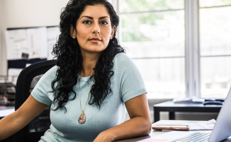 A woman at her desk in a casual office