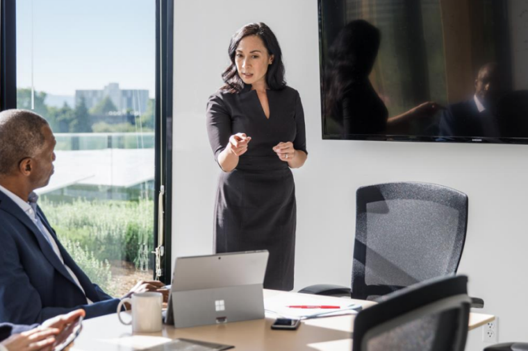 Two coworkers meeting in a conference room