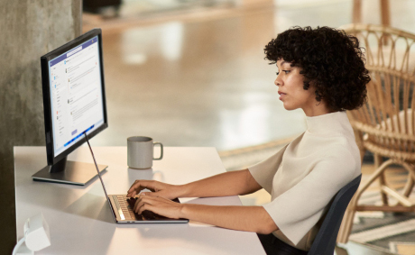 A woman chatting on her laptop