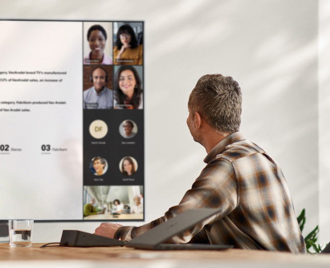 A man having a video call in a conference room