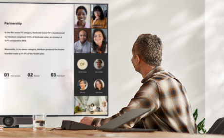 A man having a video call in a conference room