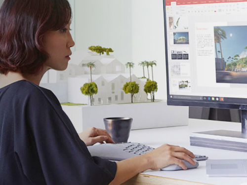 Woman working on Surface Studio