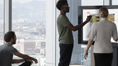 Man presenting at meeting with Surface Hub