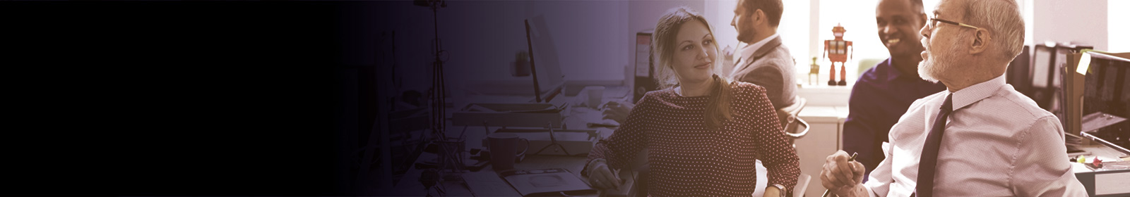 Business people conversing at desks