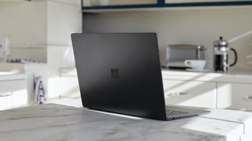 Laptop sitting on a kitchen counter 