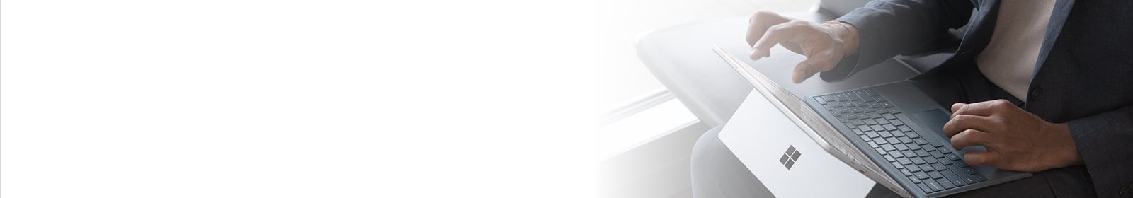 Hands typing on a laptop