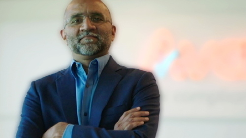 Person in business suit looking at camera