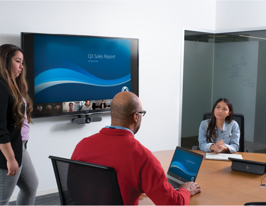 Group meeting and video call in a conference room