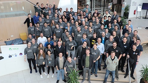 A group of people are posing together