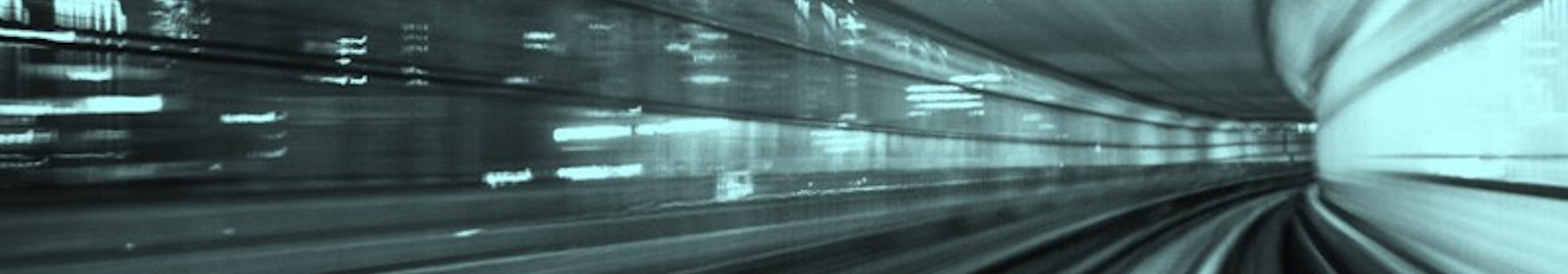 photo of rail track taken from moving train