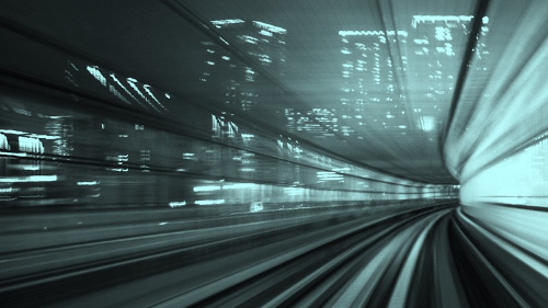photo of rail track taken from moving train