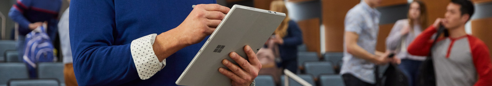 someone writing on tablet