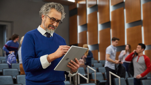someone writing on tablet