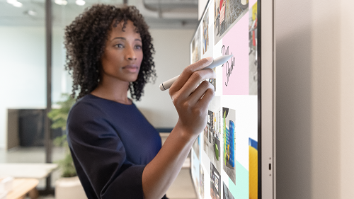 A woman working on a Surface Hub