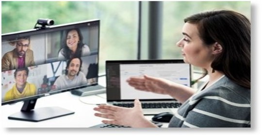 Woman having video conference with colleagues