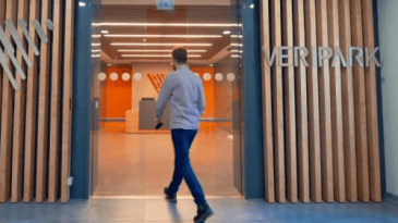Man entering Veripark office door