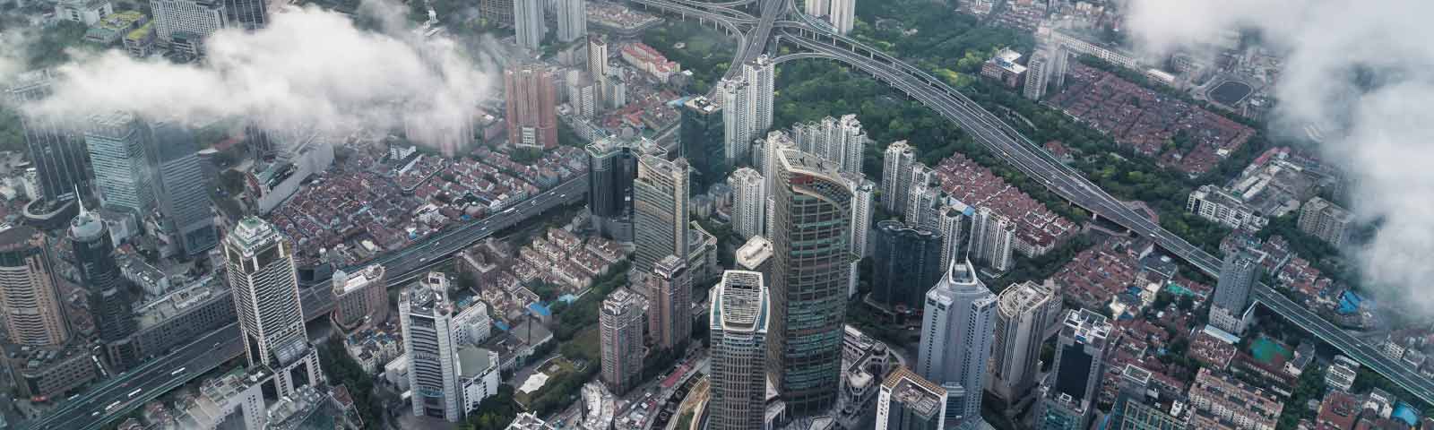 Aerial view of city skyline with clouds