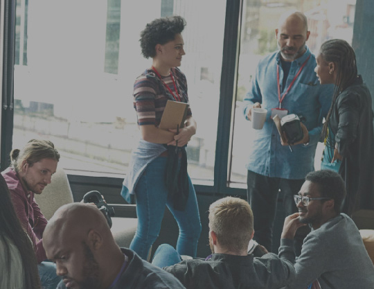 Large diverse group of people working in a modern office