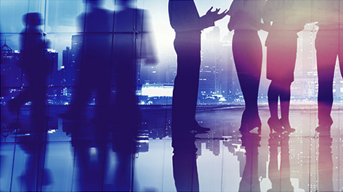 Groups of people walking or standing and talking