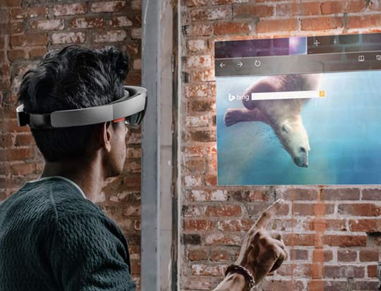 Man wearing hololens working on animated screen