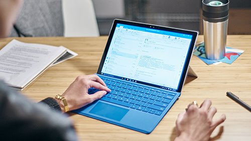Image of hand working on tablet 
