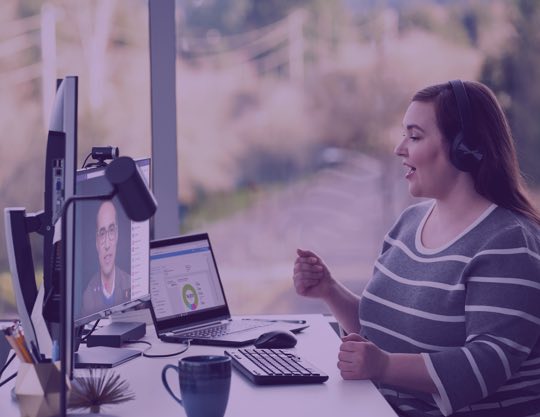 Person wearing headphones talking on a video call