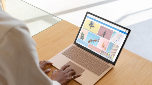 Adult woman using Surface Laptop 2