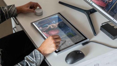 Person using Surface Pro 7 on desk