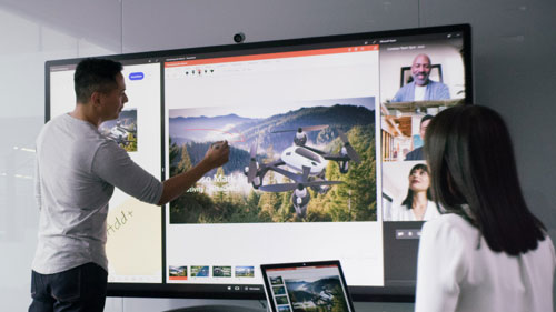 People using Surface Hub 2S with Power Point