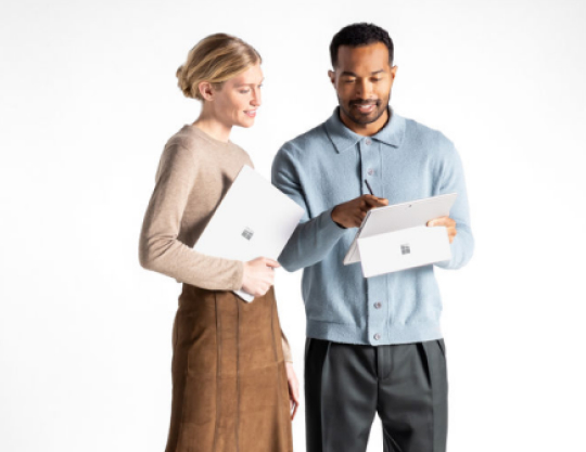 Two persons having the Surface devices