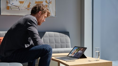 Person using Surface Pro X with Teams