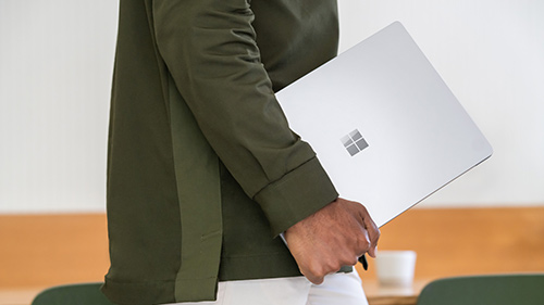 Man holding Surface Laptop 5