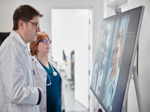 Medical staff using Surface Hub 2S in hospital