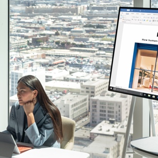 Person sitting in front of Surface Hub