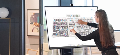 Person using the touch screen feature on the Surface Hub