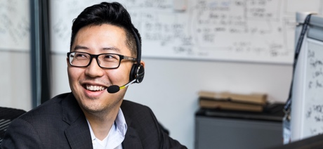 Person with headset on smiling
