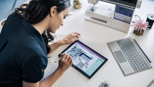 Image of a woman using a Surface Book