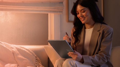 A person working with Surface device