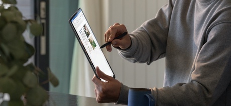 Person using a stylus on a tablet