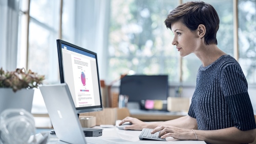 Woman working at her desk.