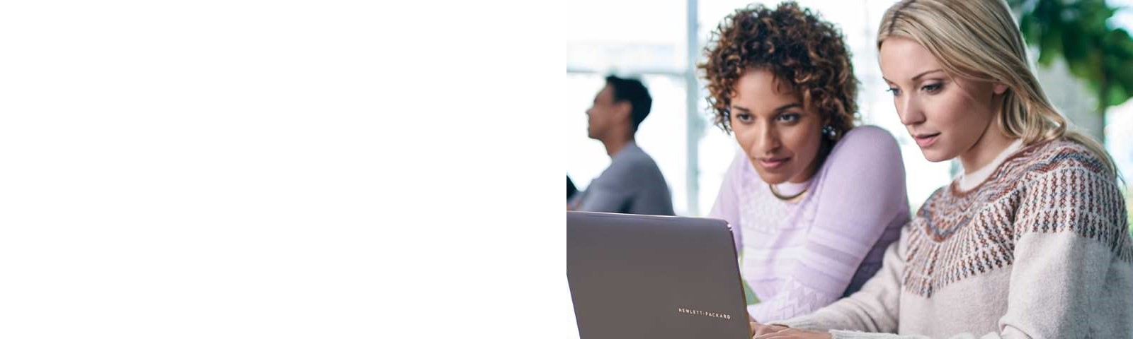 Two women discuss something in an office