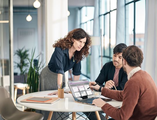 Three professionals in an office